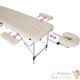 Table de massage pliable en aluminium beige avec réglage de hauteur et accoudoirs.